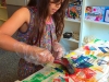Excited printmaker prints a relief print