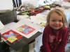 Young artist shows her work.